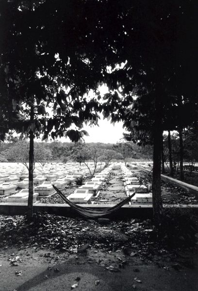 the keeper's hamock on a Vietcong war cemetery near Cu Chi, Vietnam. 